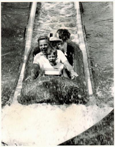 Arlington, TX: Shot of guests riding the El Asseradero located in the Spanish Sector of Six Flags Over Texas. El Asseradero, which translates to "Saw Mill" in English, was the first of its kind in the world to be constructed in 1963.