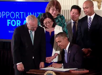 President Obama signing Executive Order 13672