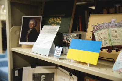 Photos of Ukrainian composers next to a Ukrainian flag in Featured Music Items display