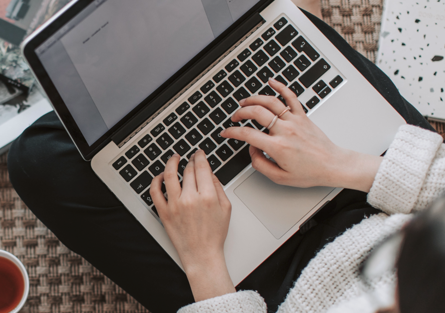 A person typing her article photo by Vlada Karpovich from Pexels