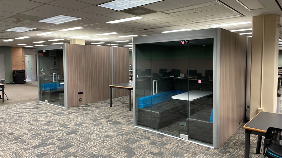 Group of personal square study rooms with soundproofed walls.