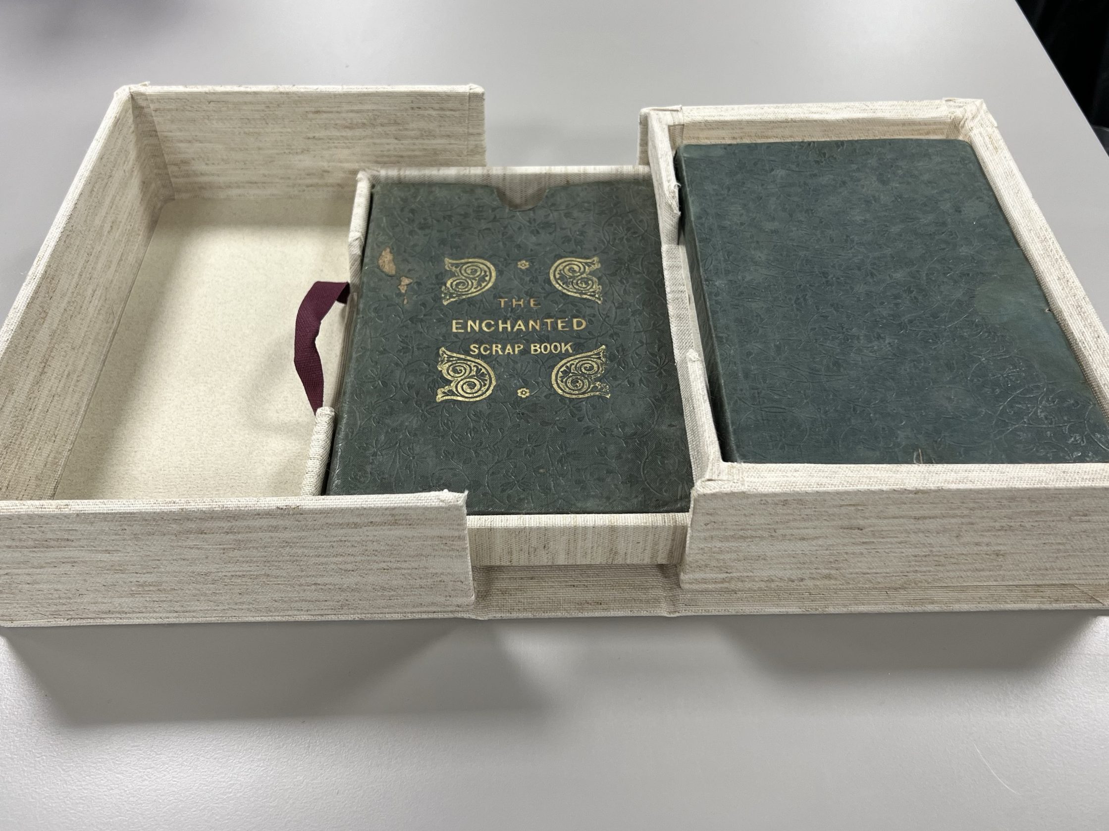 Image of an open clamshell box with a drawer pulled out.