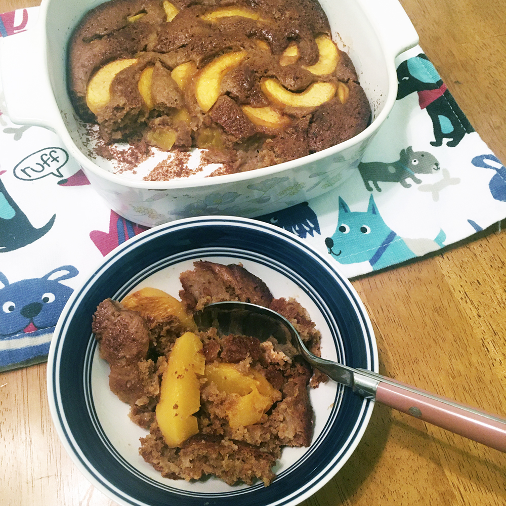 Peach cobbler with a single serving in a separate bowl.