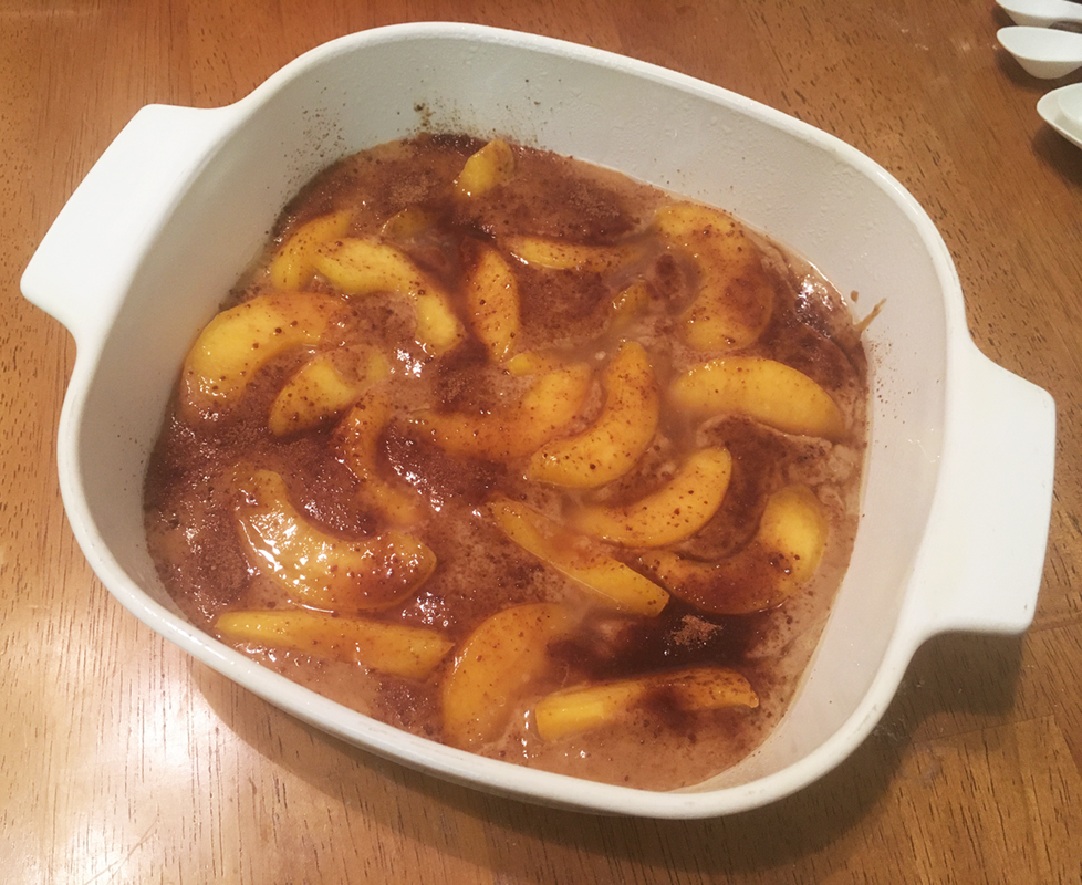 Peaches in batter, ready to bake