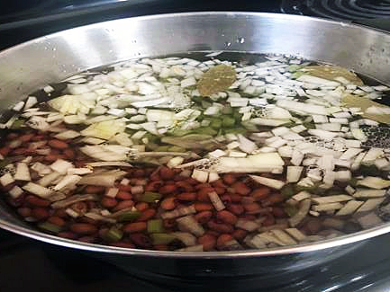 Red beans cooking in the pan.