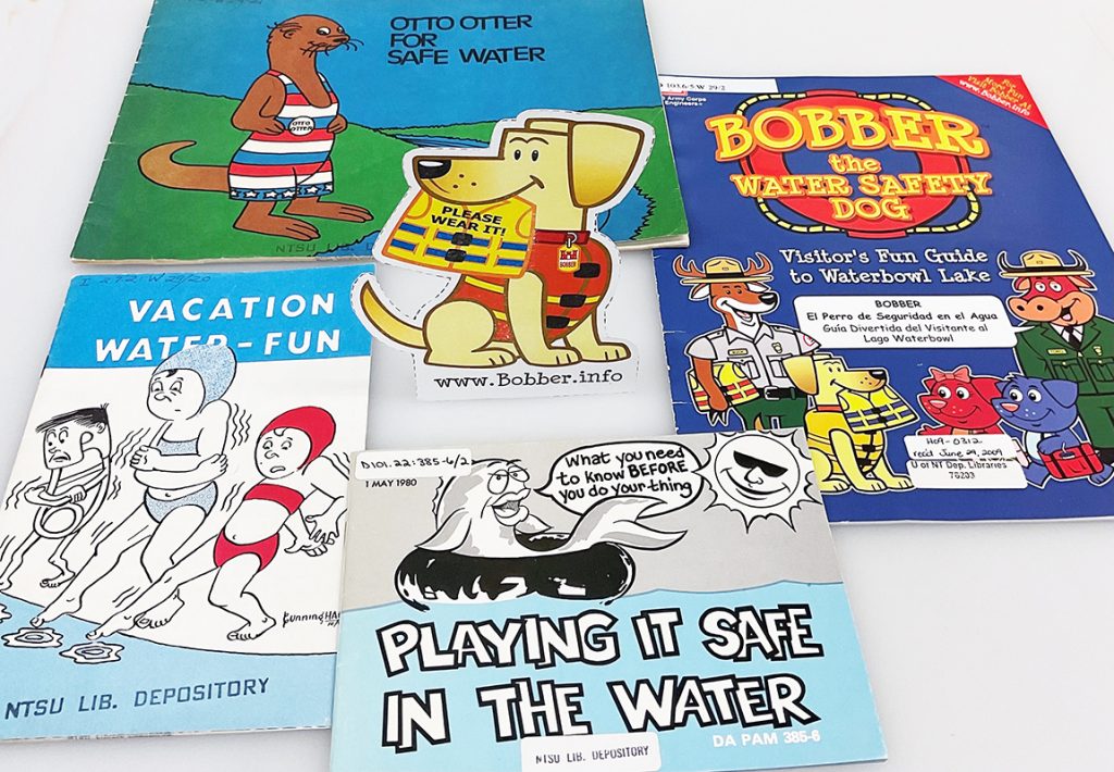 Water Safety Mascots: Otto Otter, Bobber the Water Safety Dog, an anonymous safety pin, and an anonymous fish