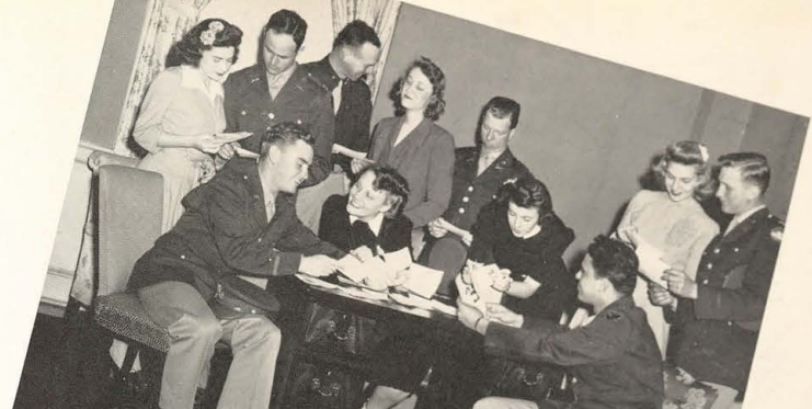 Hostesses at the TSCW Date Bureau headquarters help soldiers select dates.