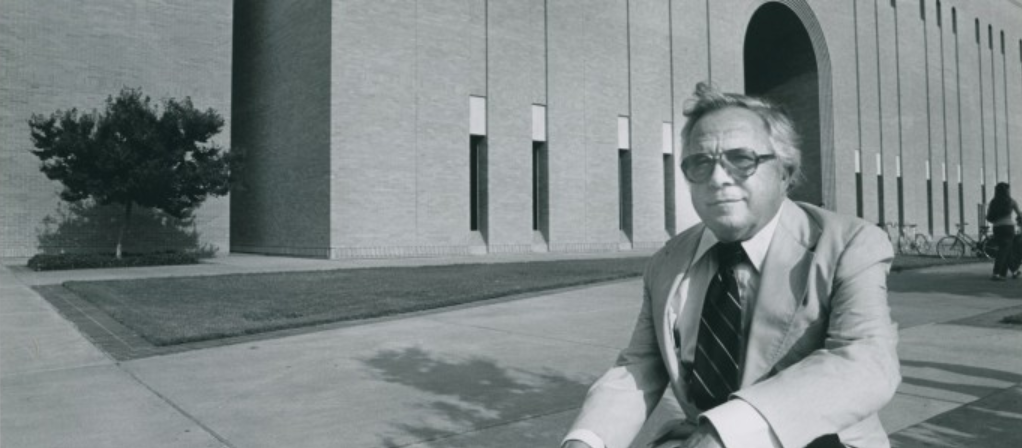 Regent A.M. Willis, Jr. seated in front of Willis Library, the building named after him.